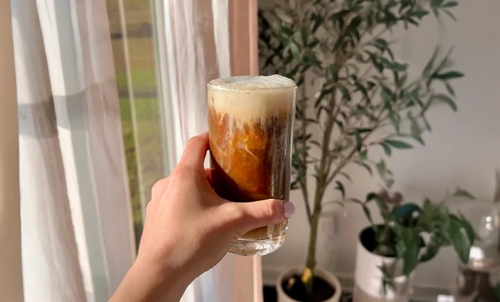 Iced Everyday Dose coffee by a window